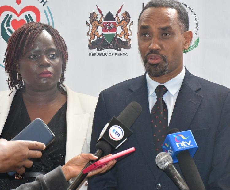 NCPD Director General Dr. Mohamed Sheikh, (Right) flanked by Dr. Nelly Munyasia, Executive Director RHNK fields questions from the media during the launch of Her Health Programme in Narobi.